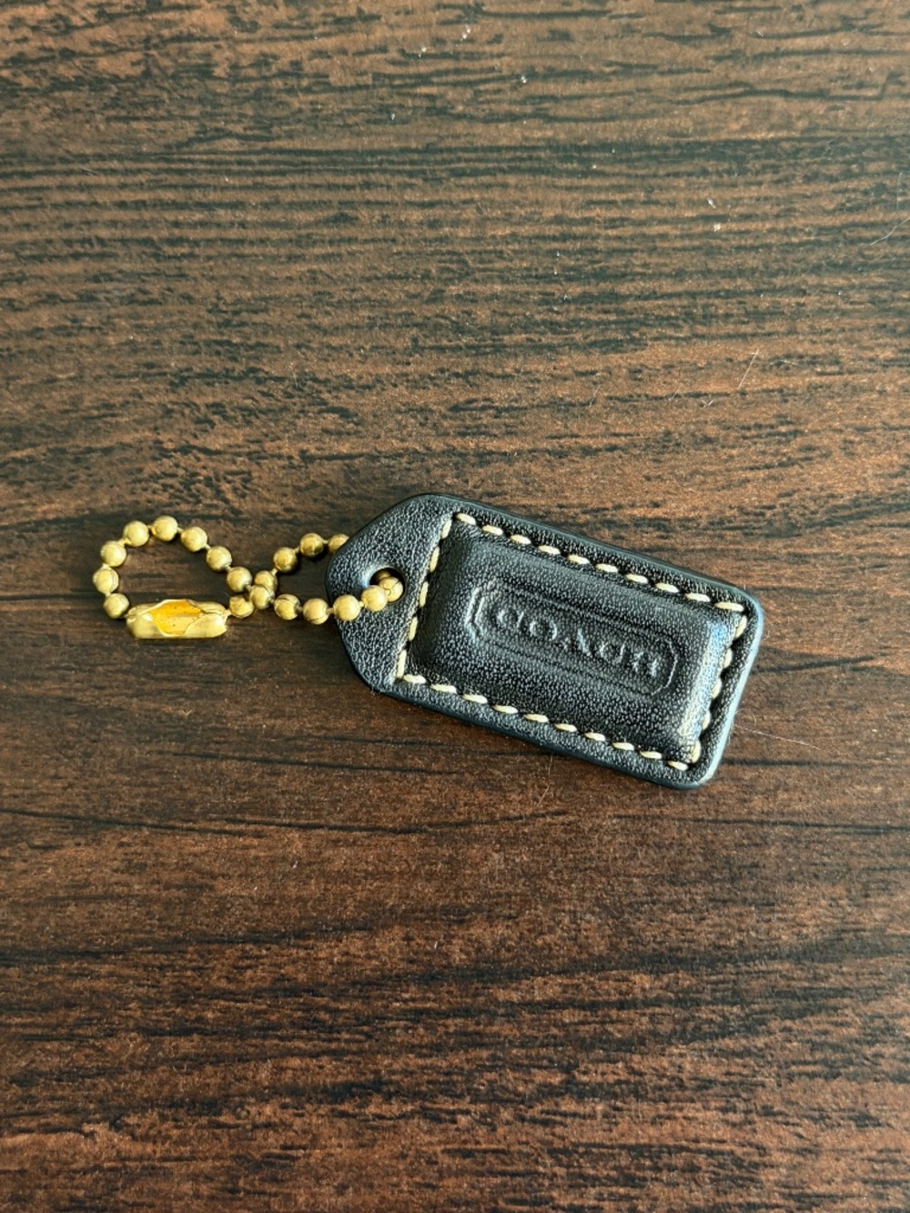 Coach black leather hangtag